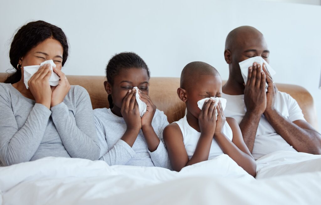 flu season shot of a family blowing their noses w 2023 11 27 05 18 35 utc min