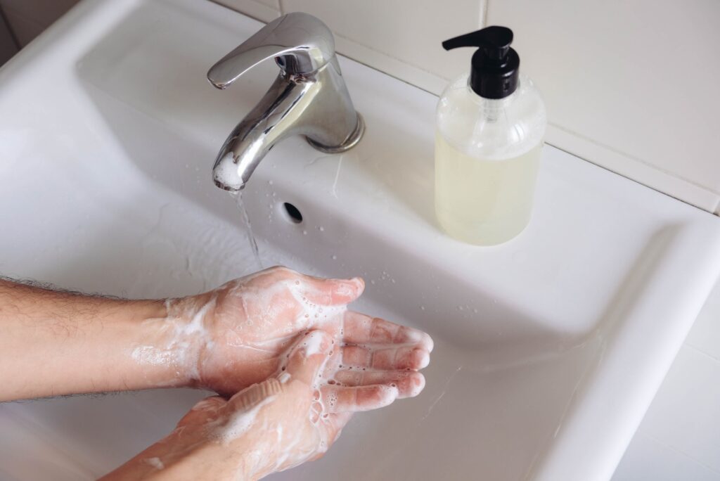 Washing hands to prevent flu and stomach flu infection